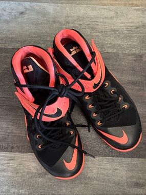 Nike LeBron Soldier 8 basketball shoes feature a black and peach-orange colorway